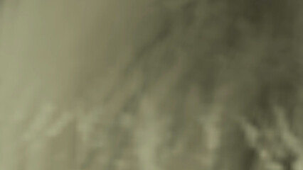 Subtle abstract texture with muted neutral tones creates a hazy effect, ideal for backgrounds or particles elements requiring a soft, diffused look.