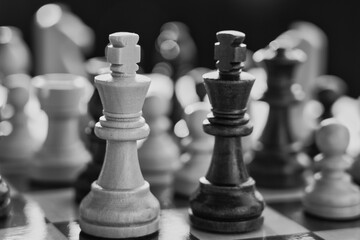 Chess pieces arranged in strategic and symbolic positions. The image can be interpreted through...