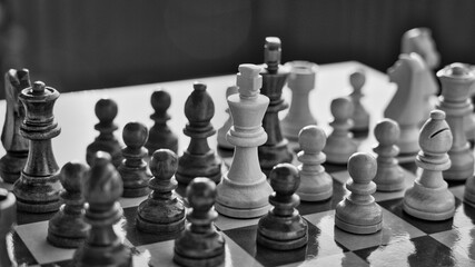 Chess pieces arranged in strategic and symbolic positions. The image can be interpreted through...