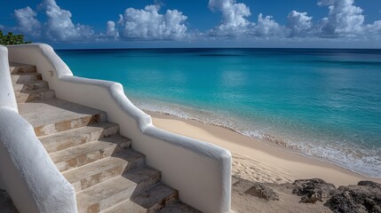 White Sand Steps Leading to a Turquoise Ocean Under a Bright Blue Sky with Fluffy Clouds