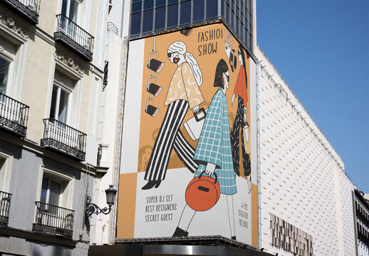 A large blank billboard stands at street corner in Madrid, ready for future advertising. The urban landscape features nearby shops and blue skies. PSD template mockup