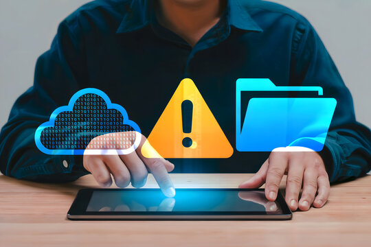A person manages digital data on a tablet, focusing on cybersecurity threats, cloud storage, and file management in a modern business setting with warnings.