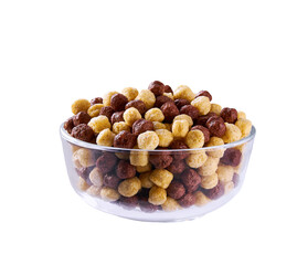 corn balls and chocolate corn balls in a clear glass bowl isolated on a white background.  Corn...