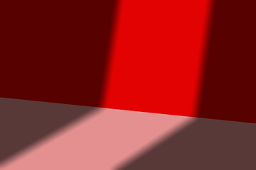 Abstract empty red scene or studio background with light casting sharp shadow on wall and floor....