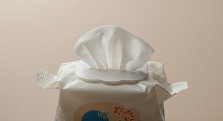 Pack of baby wipes with cloth lid on neutral background  