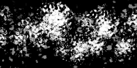 Snowflakes on dark background. white icy snowflakes isolated on black background, natural background. white crystalline powder on a black background. sugar dust. texture, pattern and clipping.