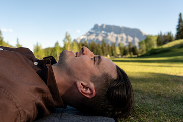 Man lying on grass smiling