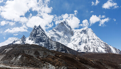 A pristine view of Ama Dablam, wrapped in clouds beneath a crystal-clear sky.