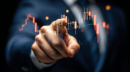 A man is pointing at a graph on a computer screen. The graph is showing a downward trend, and the man's finger is hovering over it. Concept of uncertainty and caution
