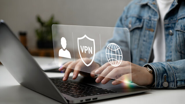 Person securing online connection through VPN on laptop, illustrating digital privacy and secure network access, emphasizing data protection and cybersecurity solutions for remote work. - Powered by Adobe