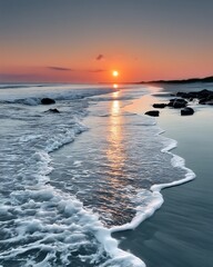 Serene Ocean Waves at Sunset on a Sandy Beach with Reflective Water and Distant Horizon
