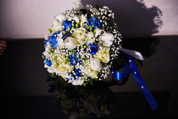 A bouquet of flowers with blue and white flowers