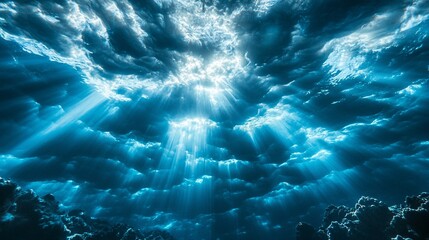 Dramatic sky with bright light rays breaking through dark, layered clouds