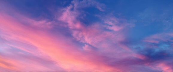 Fototapeta premium Colorful Sky with Pink, Purple, and Blue Clouds at Sunset or Sunrise