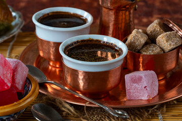 Traditional black Bosnian coffee in beautiful copper cezve and cups