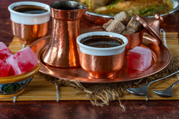 Traditional black Bosnian coffee in beautiful copper cezve and cups