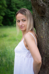 Young beautiful girl in nature in a rustic style.