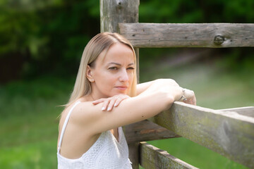 Young beautiful girl in nature in a rustic style.