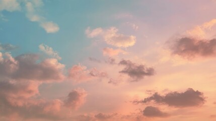 Fototapeta premium Warm Hues of Pink and Gold Sky With Clouds at Sunset or Sunrise