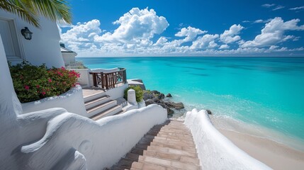 White Sand Steps Leading to a Turquoise Ocean Under a Bright Blue Sky with Fluffy Clouds