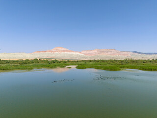Ankara Nallihan Bird Sanctuary Serene landscape view of a calm river reflecting mountains. High-angle, expansive view of  calm river reflecting the surrounding mountains Beypazari Nallihan Kus Cenneti
