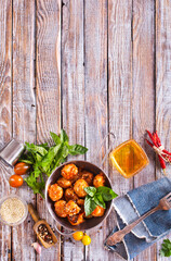 Meat meatballs with spices, sauce and garlic. Top view, copy space.