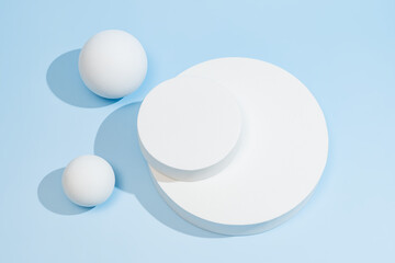 Minimalist round podium on vibrant blue background, creating a clean stage for luxury skincare...