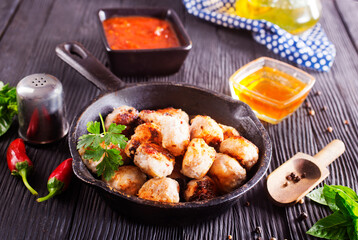 Meat meatballs with spices, sauce and garlic. Top view, copy space.