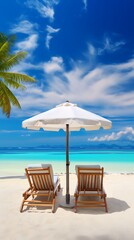 Fototapeta premium Beach chairs with umbrella and palm tree on tropical beach in Maldives