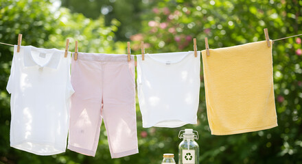 Mix of white and yellow clothes on clothesline in backyard under sunlight for promoting zero-energy laundry