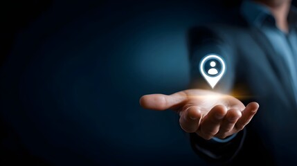 Close up of a businessman s outstretched hand with a glowing digital location pin icon hovering above the palm representing digital identity geolocation