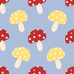 Colorful red and yellow mushrooms with white dots on blue background. Fun and quirky pattern perfect for fabric, kids design, and woodland themes.