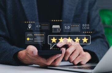Customer review and satisfaction feedback concept. Businessman using smartphone to leave five star reviews and ratings with displaying customer satisfaction scores, comments, and service evaluations.