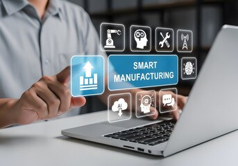 Smart Manufacturing concept. Introducing advanced technologies such as AI, ML, IoT and robotics in the manufacturing process. Businessman use laptop with smart manufacturing system on virtual screen.�