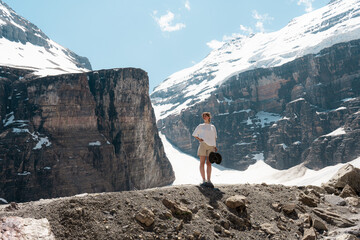 Woman standing on rocky slope