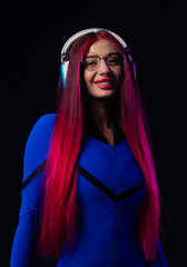 Futuristic woman in blue bodysuit with headphones