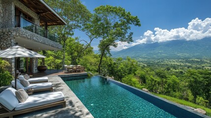Fototapeta premium A view of the hills from an infinity pool with la white lounge chairs, overlooking distant mountains