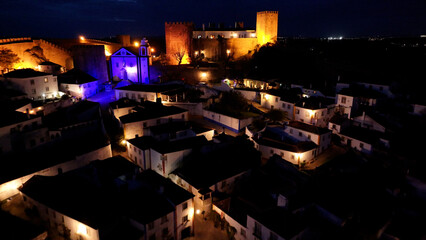 Night Scape Of Obidos Skyline At Obidos In Leiria Portugal. Old Town Skyline. Medieval Village. Illuminated Cityscape. Obidos Skyline At Obidos In Leiria Portugal. Culture Background.