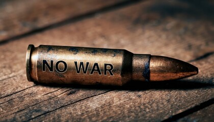 close-up of a single brass bullet with engraved no war message on wooden surface, symbolizing anti war protest, military conflict critique, and peace advocacy

