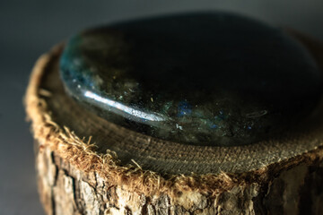 Close-up of a stunning labradorite stone, showcasing its mesmerizing iridescence and play of light...
