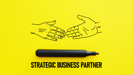 Strategic business partner is shown using the text and picture of handshake