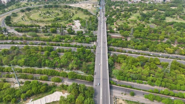 Aerial drone shot highlighting the structured and spacious road network in Noida city.