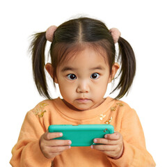 Little girl engrossed in smartphone game against a black background focus attention