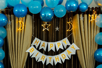 Festive Birthday Party Decorations: Blue Balloons, Gold Stars, and Happy Birthday" Banner"