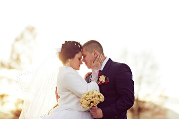 A woman in a white wedding dress is dancing in a field. Concept of joy and celebration, as the...