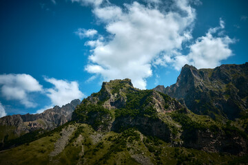 Mountain ranges on a sunny day at Georgia. Sky with clouds adn hills