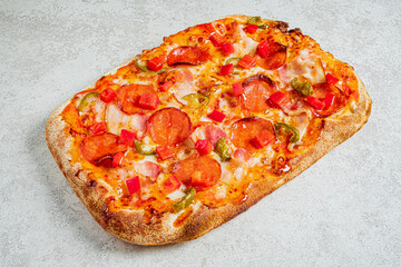 Colorful pepperoni pizza with fresh toppings sits appetizingly on a light surface, inviting all