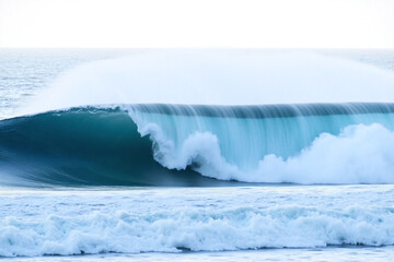 large wave in the ocean with a white background