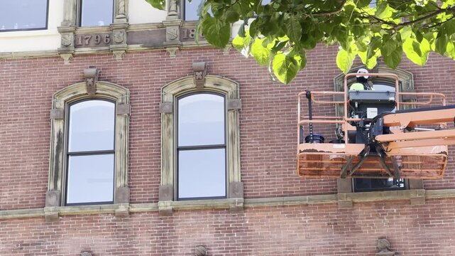 Elevated Building Ornate Window Trim Maintenance Work