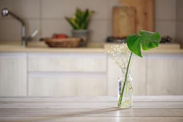 Wooden tabletop on kitchen background with blurred background. Mockup for product demonstration or...